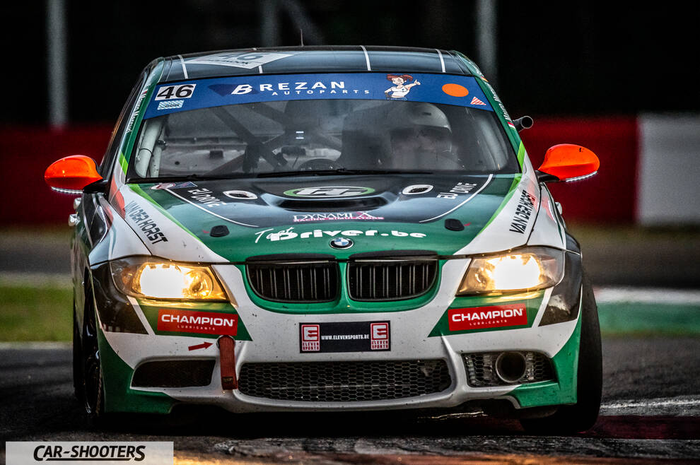 front three-quarter, green and white on a race track