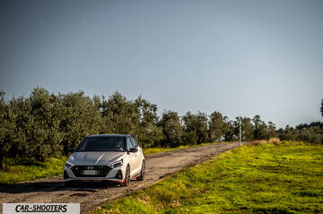 Hyundai i2N – front three-quarter, white on a country road