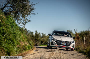 Hyundai i2N – front three-quarter, white on a country road