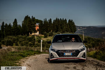 Hyundai i2N – front three-quarter, white on a country road