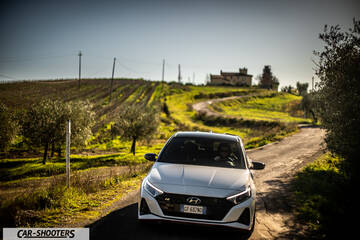 Hyundai i2N – front three-quarter, white on a country road