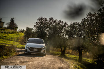 Hyundai i2N – front three-quarter, white on a country road