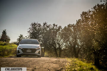 Hyundai i2N – front three-quarter, white on a country road
