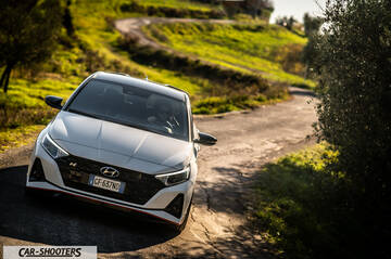 Hyundai i2N – front three-quarter, white on a country road