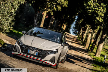 Hyundai i2N – front three-quarter, white on a country road