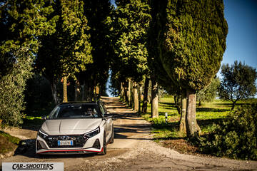 Hyundai i2N – front three-quarter, white on a country road