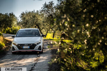 Hyundai i2N – front three-quarter, white on a country road