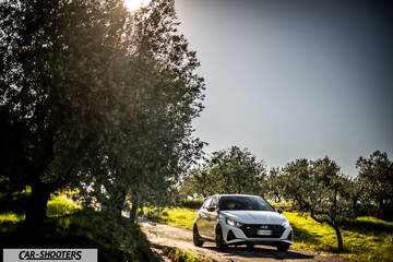 Hyundai i2N – front three-quarter, white on a country road