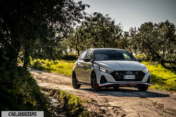 Hyundai i2N – front three-quarter, white on a country road