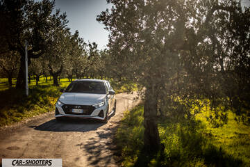 Hyundai i2N – front three-quarter, white on a country road