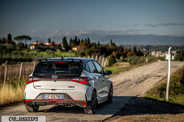 Hyundai i2N – rear three-quarter, white on a country road
