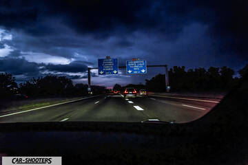 Tesla Model S Plaid – interior, view from inside a car driving on a highway at night