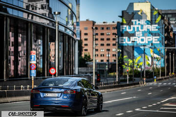 Tesla Model S Plaid &ndash; rear view, blue metallic on a city street