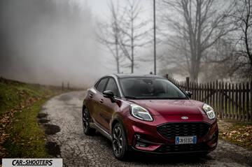 Ford Puma STLine – front three-quarter, dark red on a country road