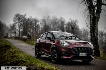 Ford Puma STLine – front three-quarter, dark red on a country road