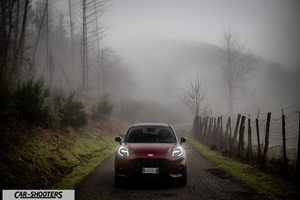 Ford Puma STLine – front three-quarter, dark red on a country road