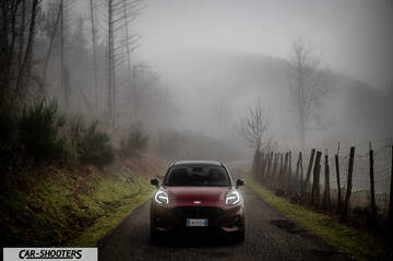 Ford Puma STLine – front three-quarter, dark red on a country road