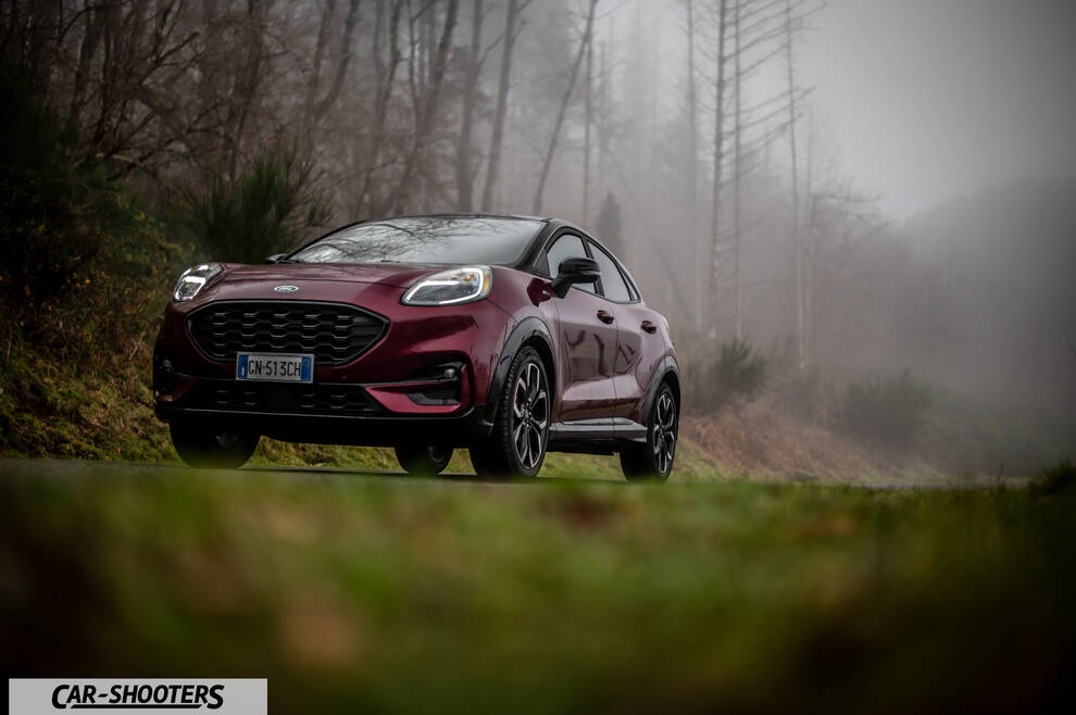Ford Puma STLine – front three-quarter, dark red metallic on a foggy country road