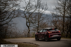 Ford Puma STLine – rear three-quarter, dark red against a mountain backdrop