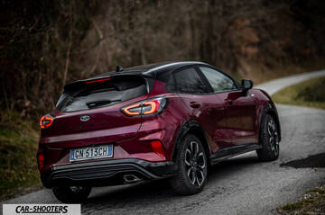 Ford Puma STLine – rear three-quarter, dark red on a country road