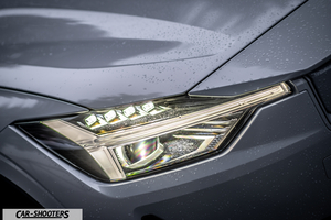 Polestar 2 – detail, headlight close-up with raindrops