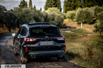 Ford Kuga STLine – rear three-quarter, black on a country road