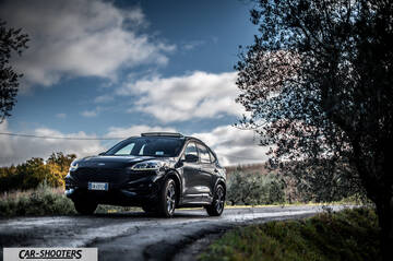 Ford Kuga STLine – front three-quarter, dark grey on a country road