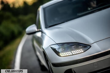 Hyundai Ioniq 6 – front three-quarter, silver on a country road