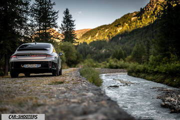Hyundai Ioniq 6 – rear view, silver on a gravel road by a river