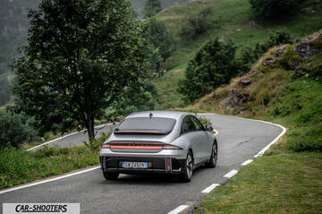 Hyundai Ioniq 6 – rear view, silver on a winding mountain road
