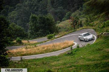 Hyundai Ioniq 6 – front three-quarter, silver on a winding mountain road