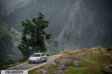 Hyundai Ioniq 6 – front three-quarter, silver against a mountain backdrop