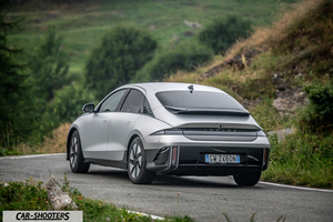 Hyundai Ioniq 6 – rear three-quarter, silver on a mountain road