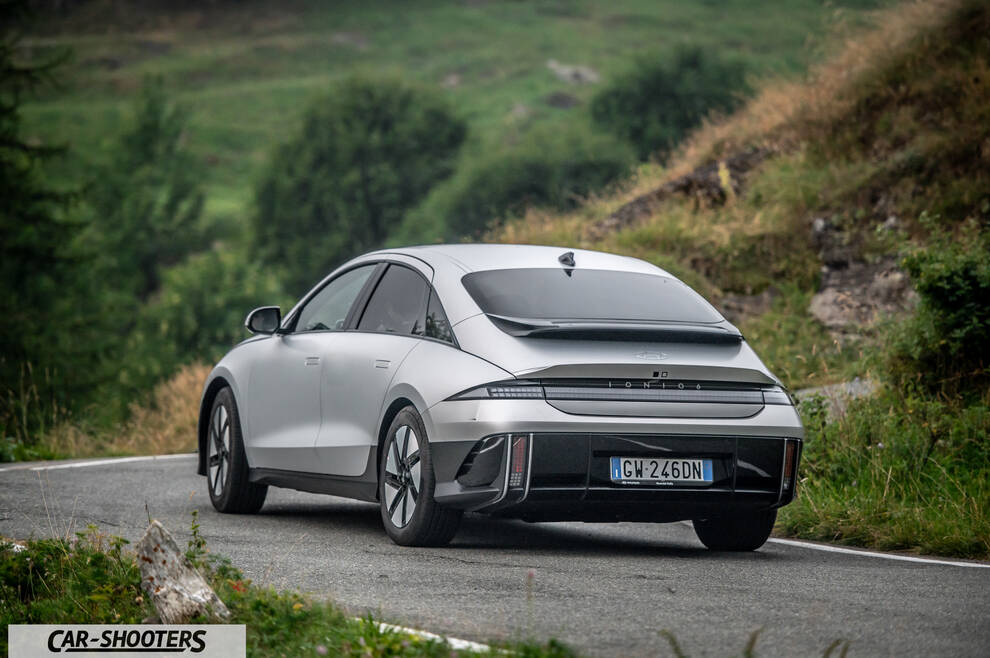Hyundai Ioniq 6 – rear three-quarter, silver on a mountain road