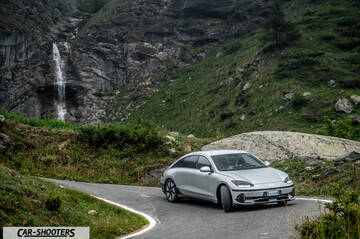 Hyundai Ioniq 6 – front three-quarter, silver against a mountain backdrop