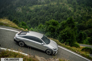 Hyundai Ioniq 6 – front three-quarter, silver on a winding mountain road