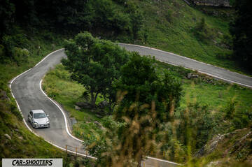Hyundai Ioniq 6 – front three-quarter, silver on a winding mountain road