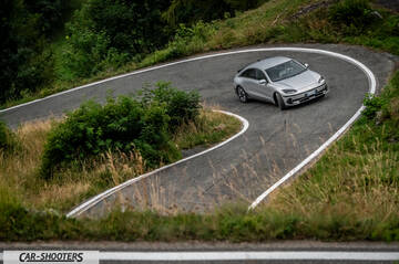 Hyundai Ioniq 6 – front three-quarter, silver on a winding mountain road