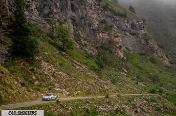 Hyundai Ioniq 6 – front three-quarter, silver against a mountain backdrop