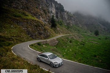 Hyundai Ioniq 6 – front three-quarter, silver on a winding mountain road