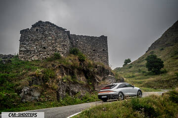 Hyundai Ioniq 6 – rear three-quarter, silver against a mountain backdrop