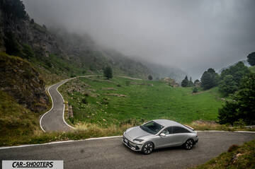 Hyundai Ioniq 6 – front three-quarter, silver against a mountain backdrop