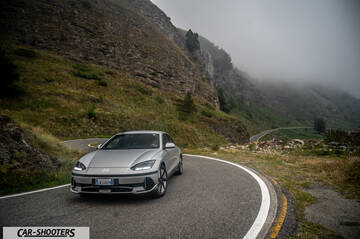 Hyundai Ioniq 6 – front three-quarter, silver metallic on a winding mountain road