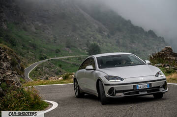 Hyundai Ioniq 6 – front three-quarter, silver against a mountain backdrop