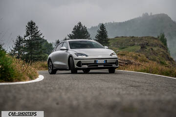 Hyundai Ioniq 6 – front three-quarter, silver on a winding mountain road
