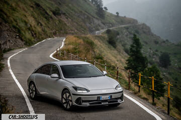 Hyundai Ioniq 6 – front three-quarter, silver on a winding mountain road