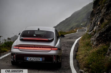 Hyundai Ioniq 6 – rear view, silver on a winding mountain road