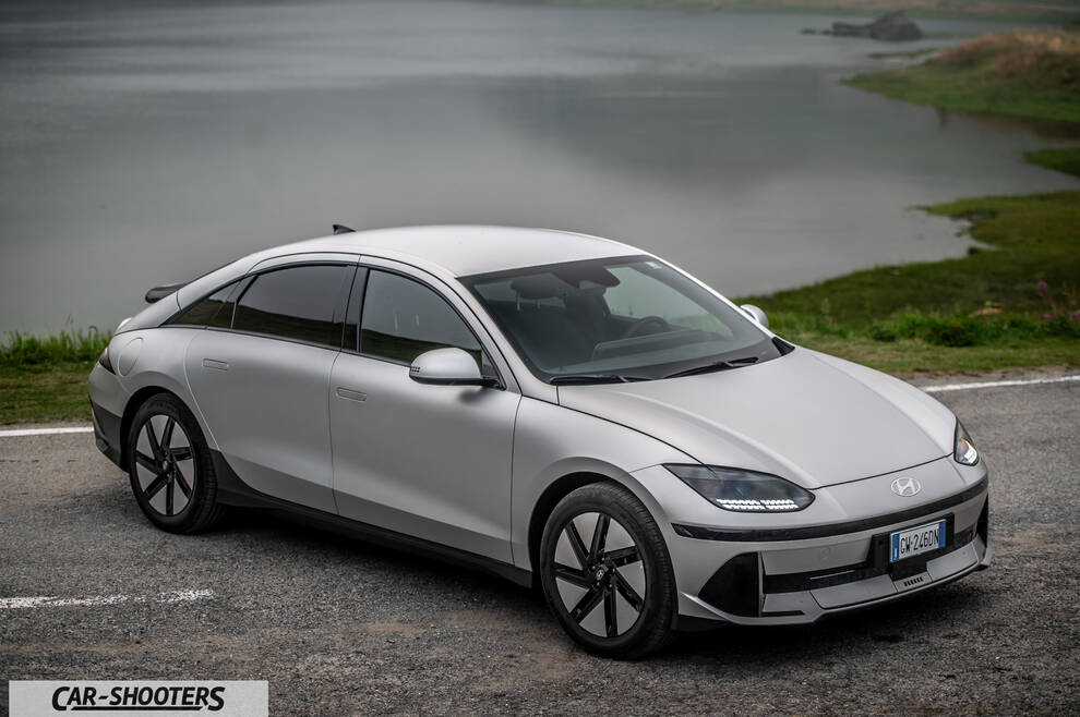 Hyundai Ioniq 6 – front three-quarter, silver on a road by water