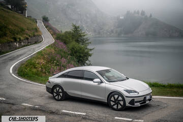Hyundai Ioniq 6 &ndash; front three-quarter, silver on a mountain road