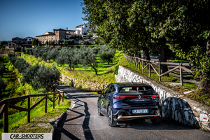 Renault Megane E TECH – rear three-quarter, dark blue on a country road